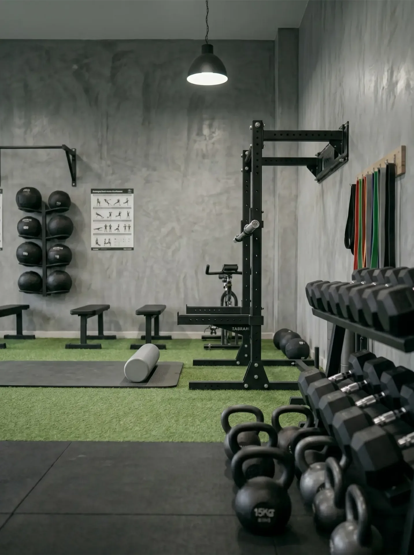 Personal training gym with kettlebells, dumbbells, and functional training equipment at Biokinetics Toronto